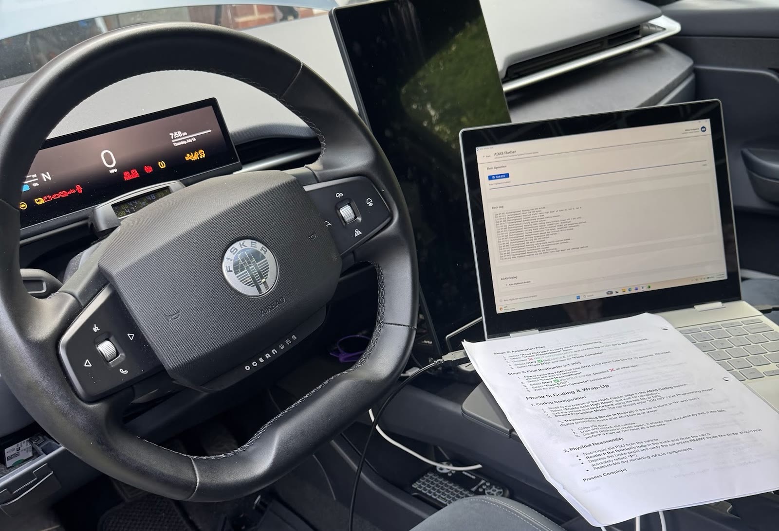 Electric vehicle repair software diagnostics on a laptop